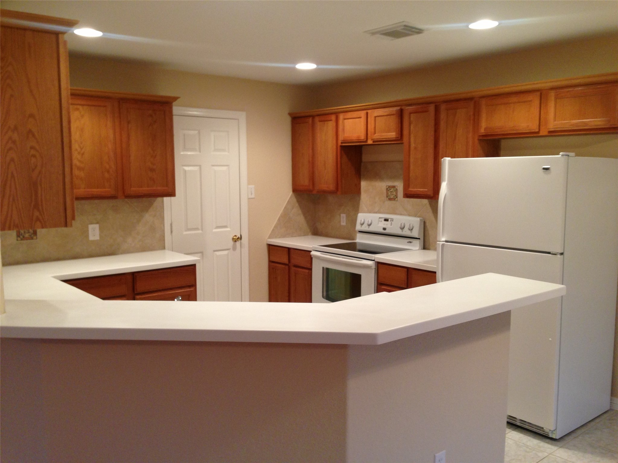9110 Prairie Trails Drive Spring, TX 77379 - Photo 5 of 34 a kitchen with stainless steel appliances a refrigerator a stove a sink and a refrigerator
