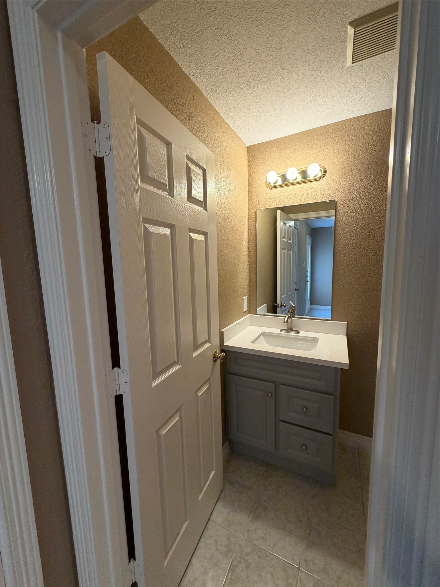 9110 Prairie Trails Drive Spring, TX 77379 - Photo 9 of 34 a bathroom with a sink and a mirror