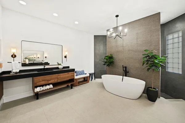 a living room with furniture and a potted plant