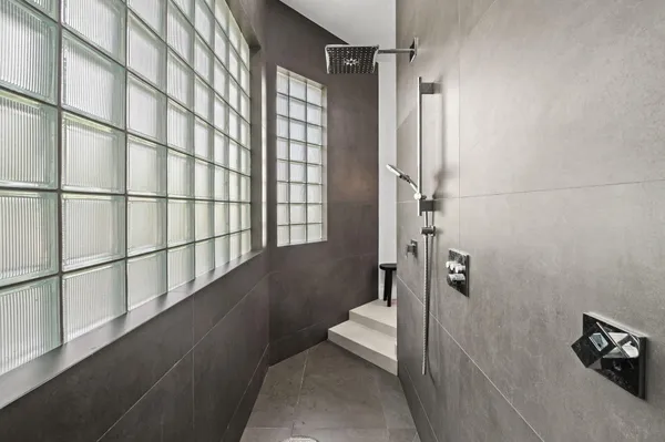 a bathroom with a shower and a toilet