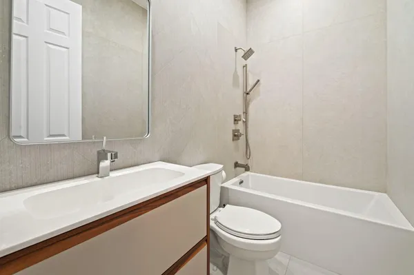 a bathroom with a sink a toilet and a bathtub