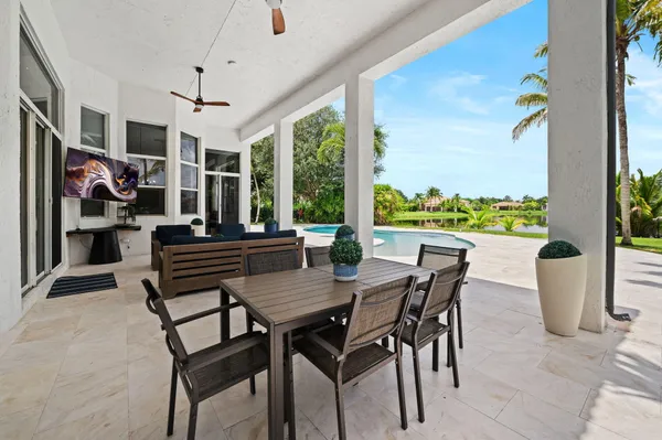 a view of a dining room with furniture window and outside view