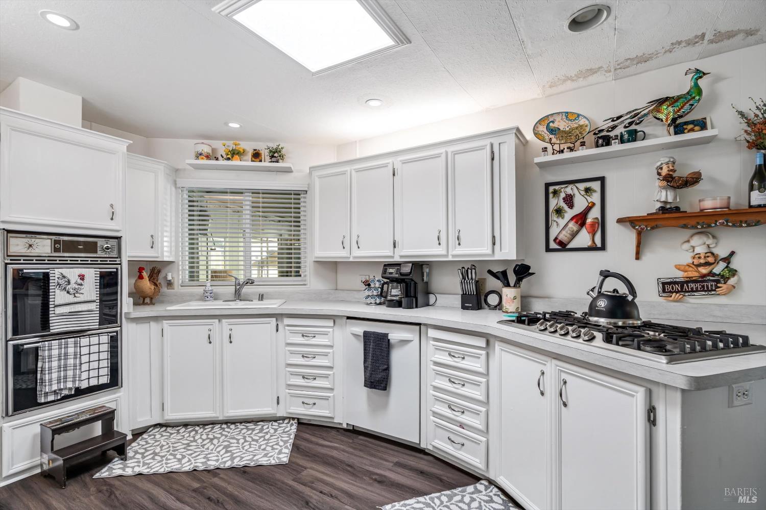 192 Mosshill Court Santa Rosa, CA 95409 - Photo 12 of 31 a kitchen with a sink stove and cabinets