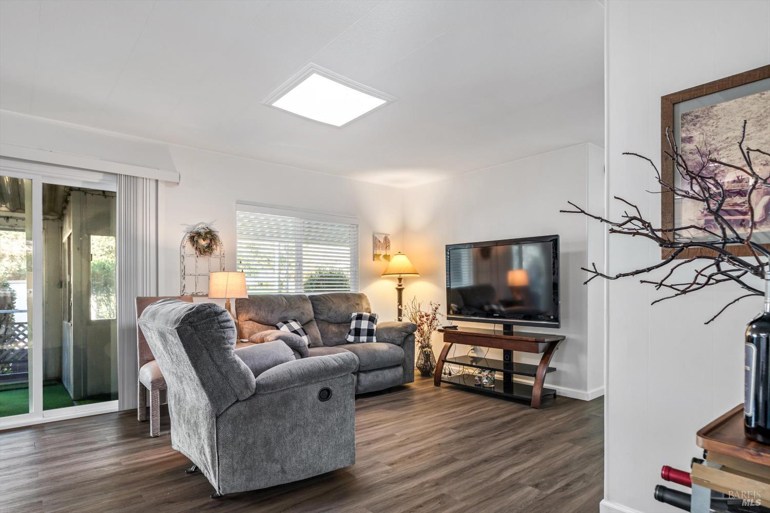 192 Mosshill Court Santa Rosa, CA 95409 - Photo 15 of 31 a living room with furniture and a flat screen tv