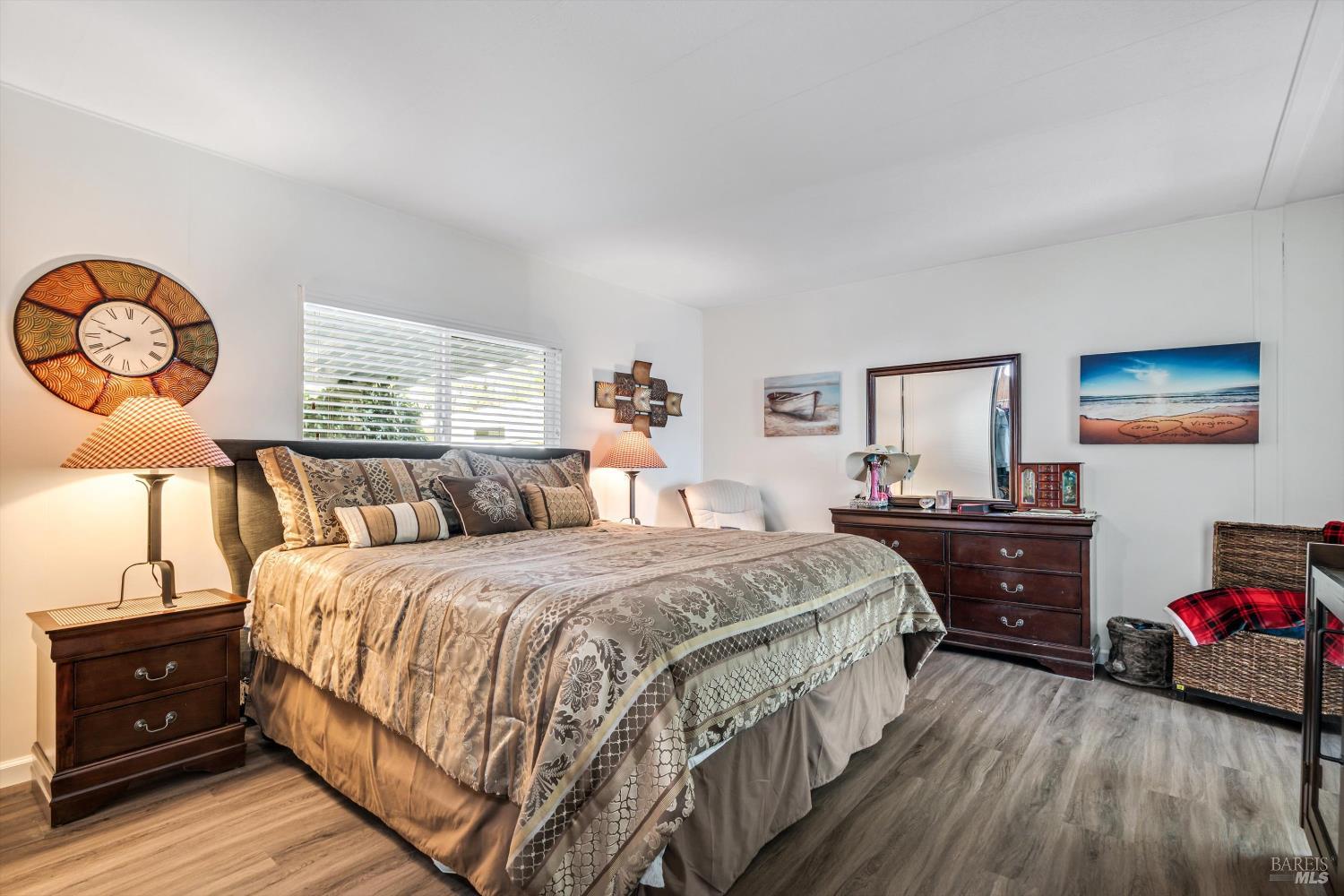 192 Mosshill Court Santa Rosa, CA 95409 - Photo 16 of 31 a bedroom with a bed and wooden floor