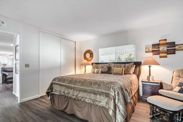 a bedroom with a bed and a dresser in it