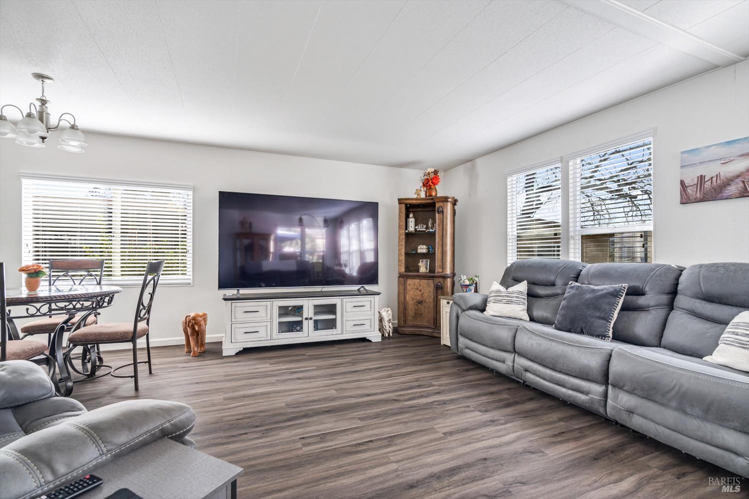 192 Mosshill Court Santa Rosa, CA 95409 - Photo 6 of 31 a living room with furniture and a flat screen tv