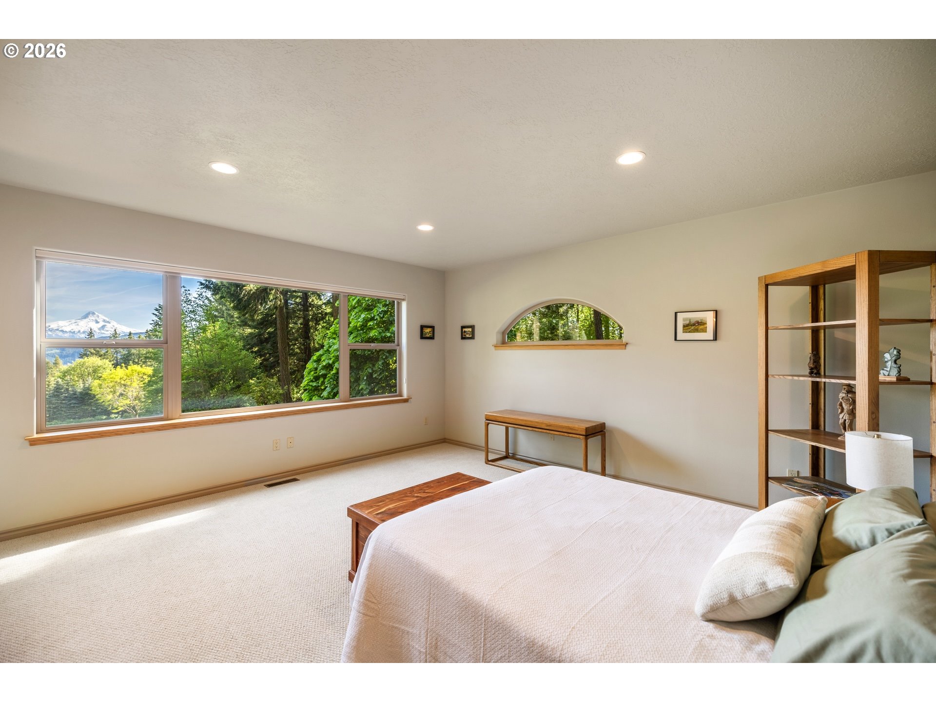9491 Cook-Underwood Road Underwood, WA 98651 - Photo 22 of 46 a bedroom with a large bed and a large window