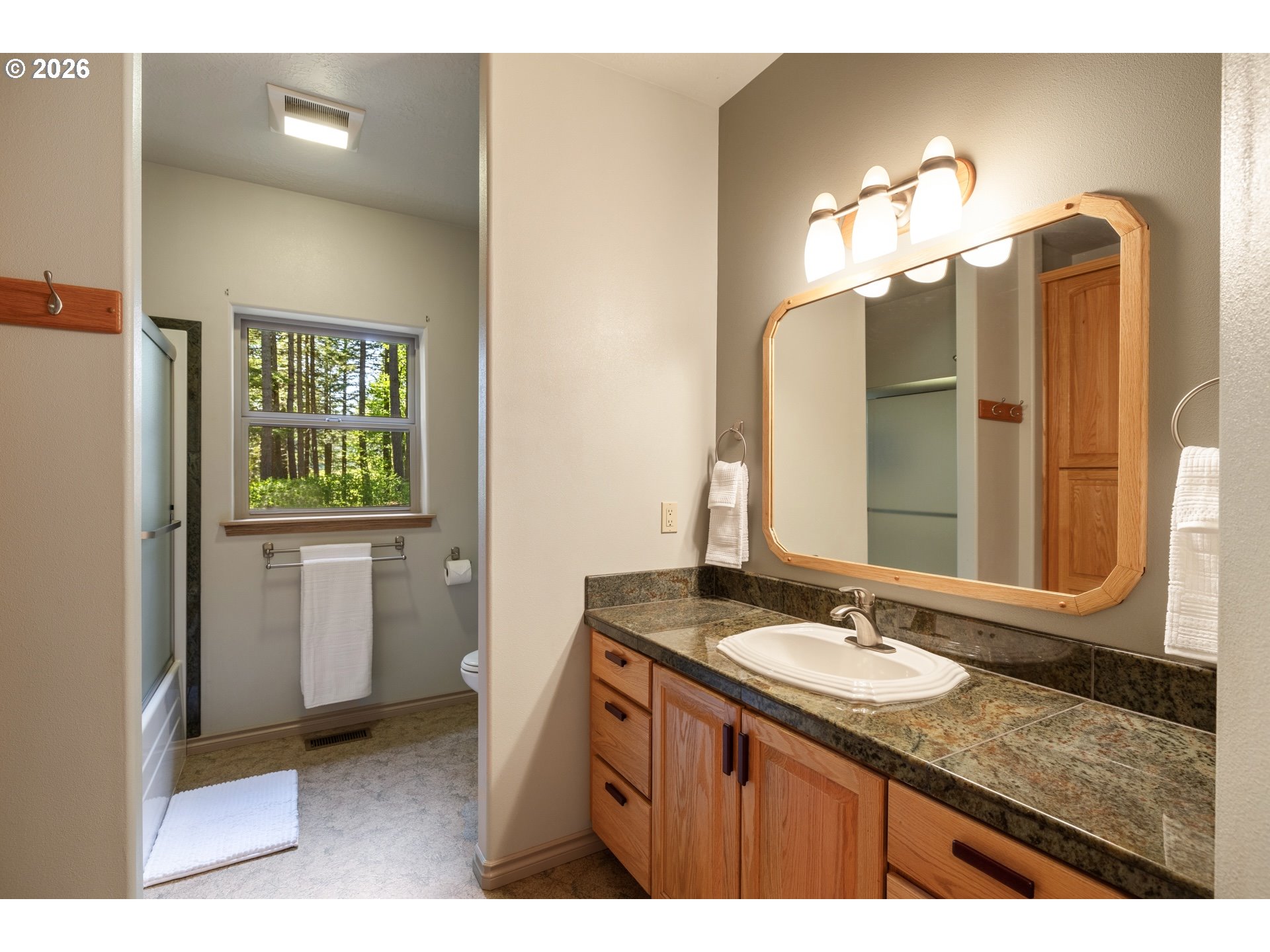 9491 Cook-Underwood Road Underwood, WA 98651 - Photo 24 of 46 a bathroom with a sink double vanity and a mirror