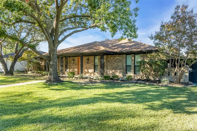 a front view of a house with swimming pool having outdoor seating
