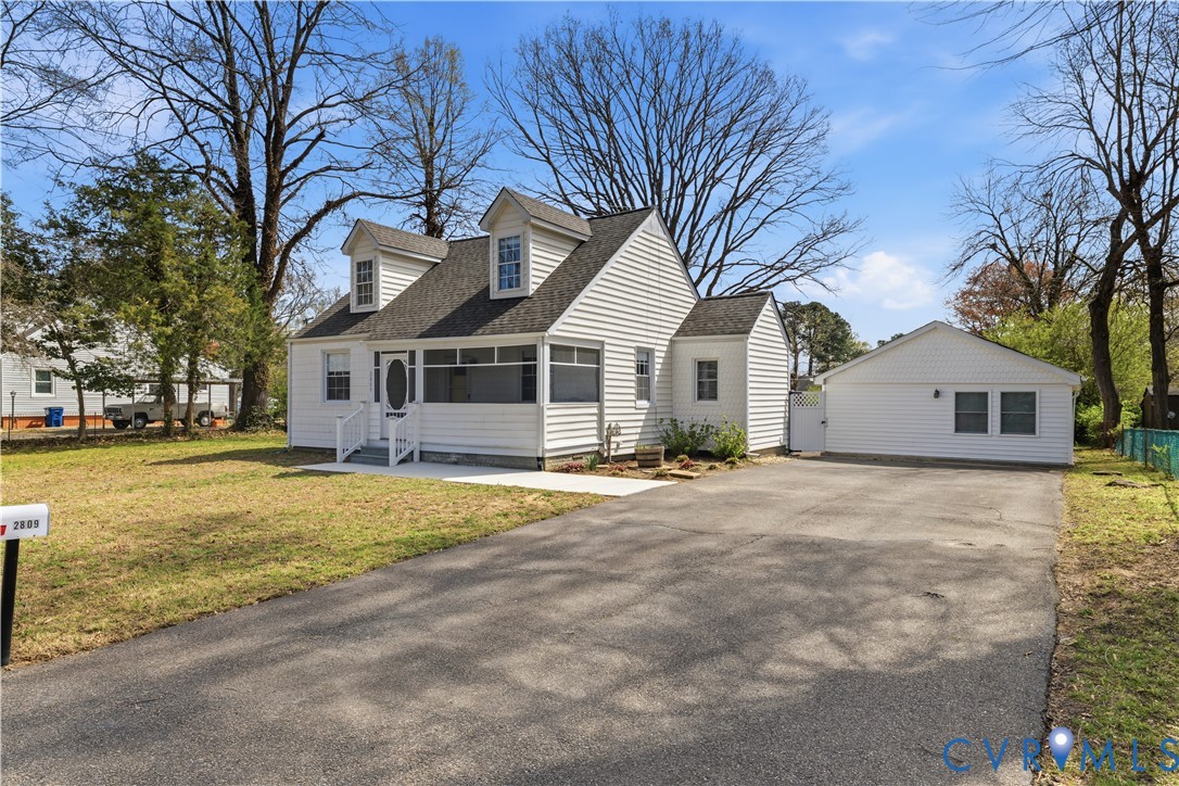 2809 Brampton Way North Chesterfield, VA 23234 - Photo 1 of 38 a front view of a house with a yard and garage