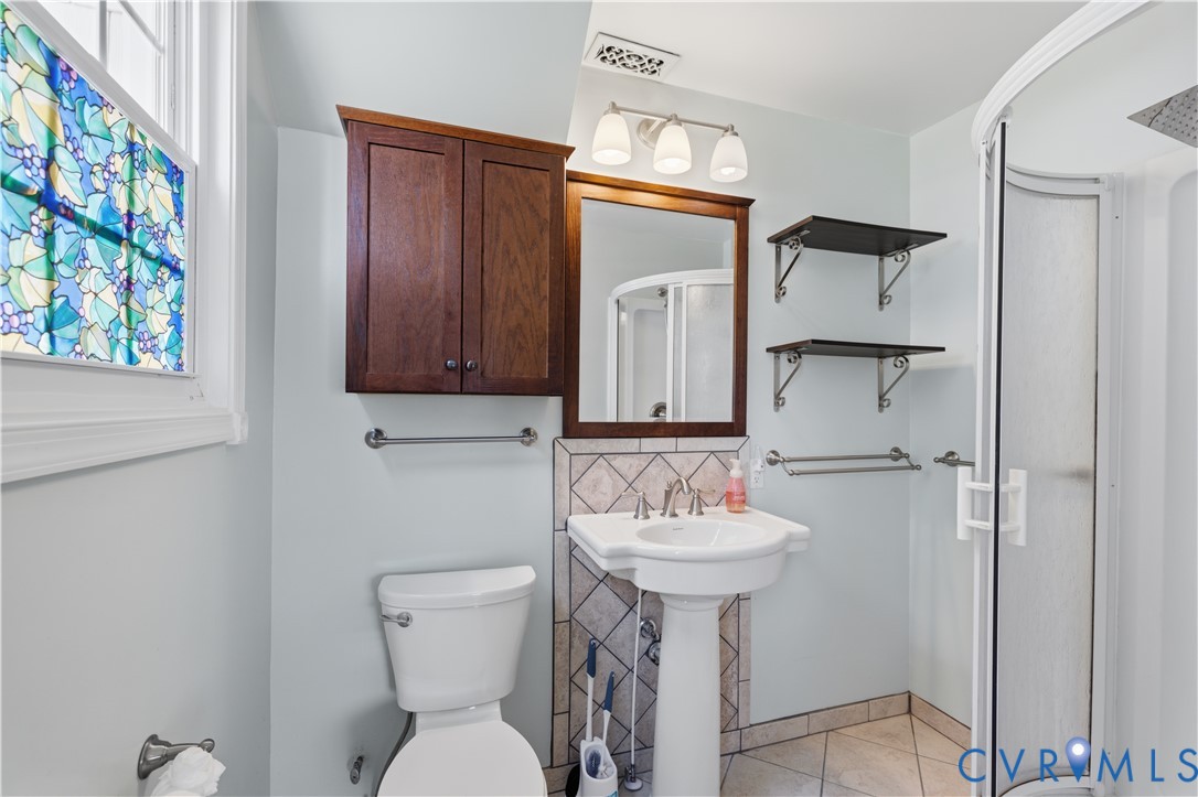 2809 Brampton Way North Chesterfield, VA 23234 - Photo 12 of 38 a bathroom with a sink a toilet and mirror