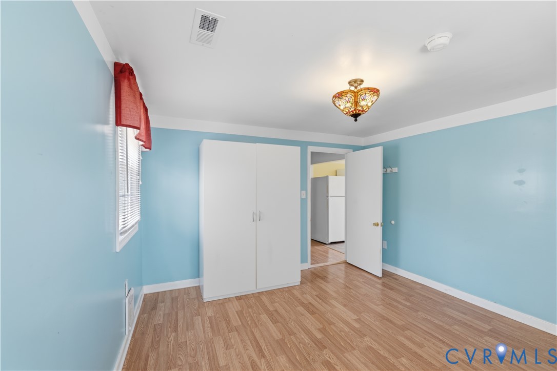 2809 Brampton Way North Chesterfield, VA 23234 - Photo 26 of 38 a view of an empty room with window and wooden floor