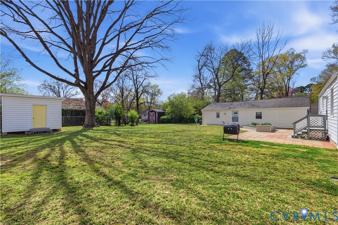 2809 Brampton Way North Chesterfield, VA 23234 - Photo 30 of 38 a backyard of a house with table and chairs