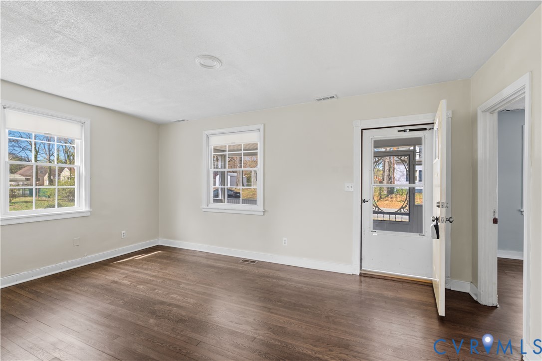 2809 Brampton Way North Chesterfield, VA 23234 - Photo 3 of 38 an empty room with wooden floor and windows