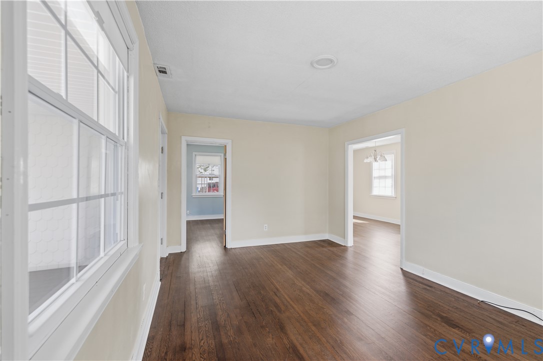 2809 Brampton Way North Chesterfield, VA 23234 - Photo 7 of 38 a view of an empty room with wooden floor and a window