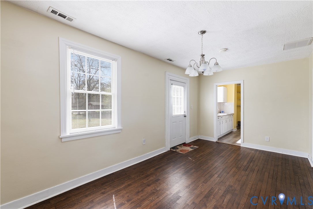 2809 Brampton Way North Chesterfield, VA 23234 - Photo 9 of 38 wooden floor in an empty room with a window