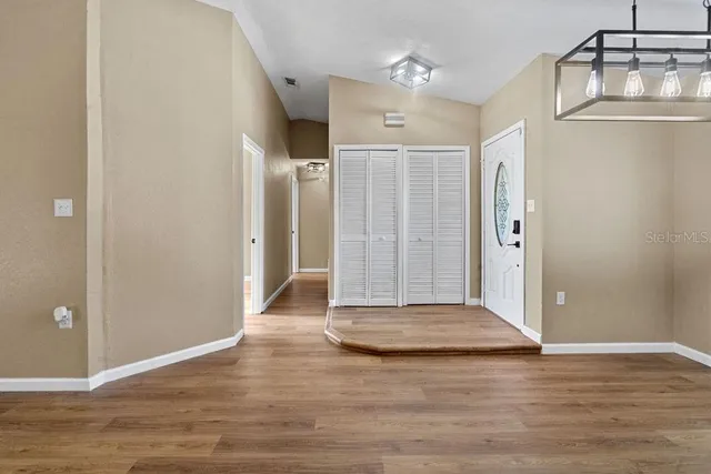 a view of entryway with wooden floor