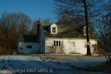 1504 Ednor Road Silver Spring, MD 20905 - Photo 1 of 1 a front view of a house with a yard
