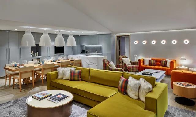 a living room with lots of furniture and a wooden floor