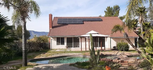 a view of a yard with swimming pool