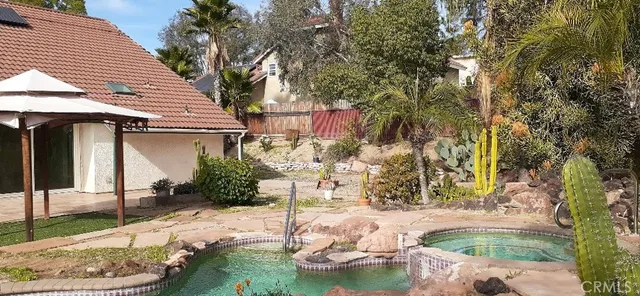 a view of a backyard with plants