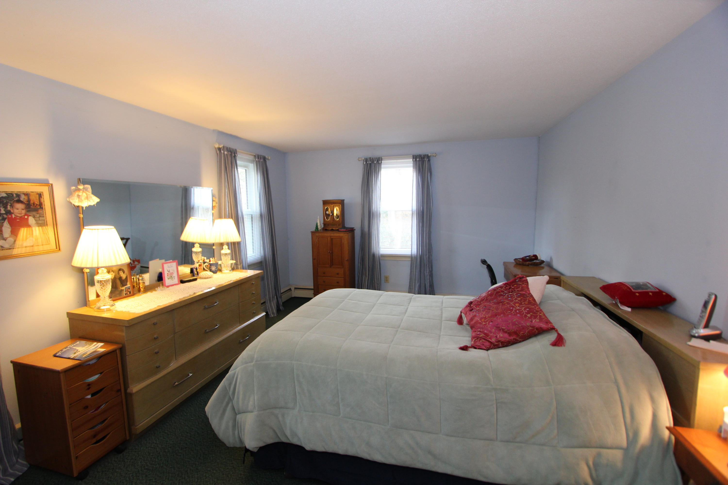 26 Crowell Road Sandwich, MA 02563 - Photo 11 of 14 a bedroom with a bed and a dresser