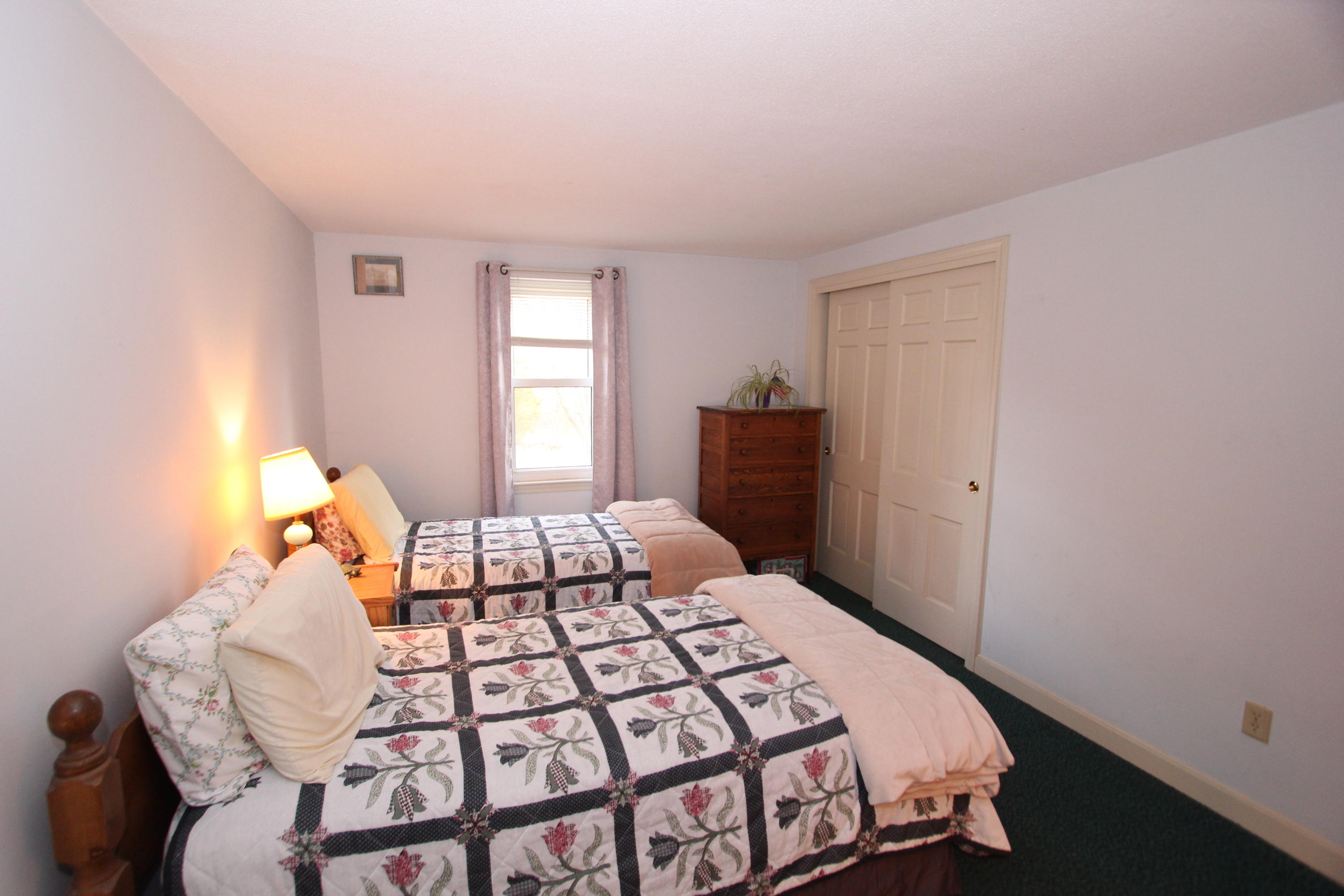 26 Crowell Road Sandwich, MA 02563 - Photo 12 of 14 a bedroom with a bed and window