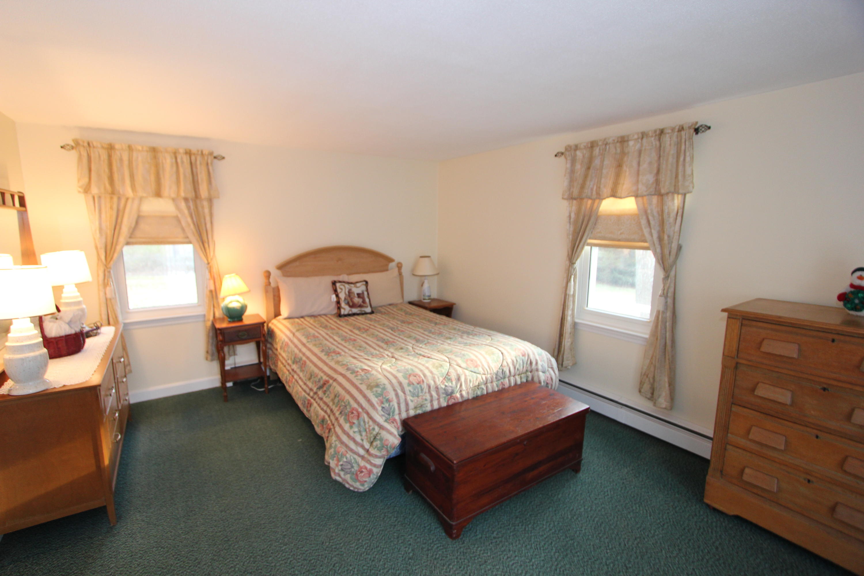 26 Crowell Road Sandwich, MA 02563 - Photo 13 of 14 a bedroom with a bed and window