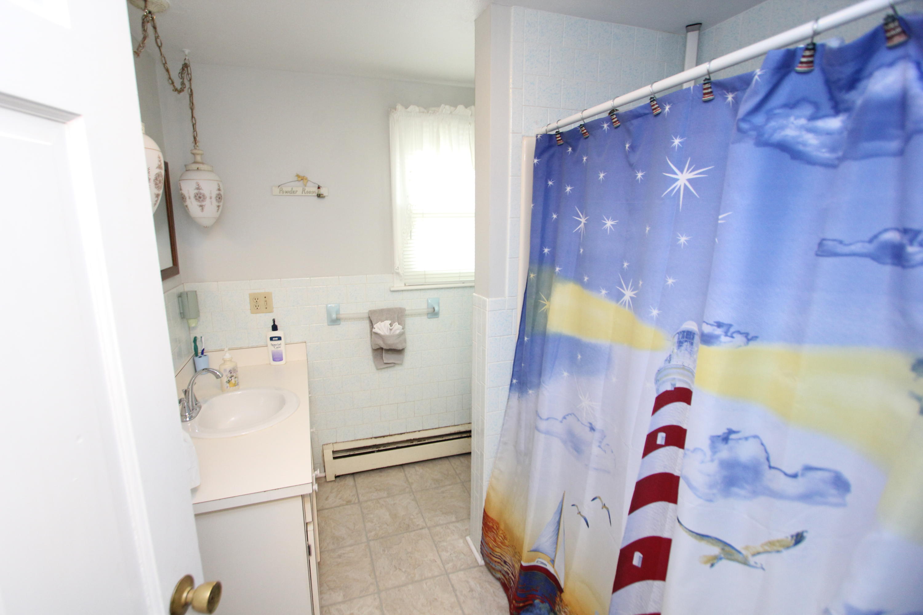 26 Crowell Road Sandwich, MA 02563 - Photo 14 of 14 a bathroom with a bathtub and shower