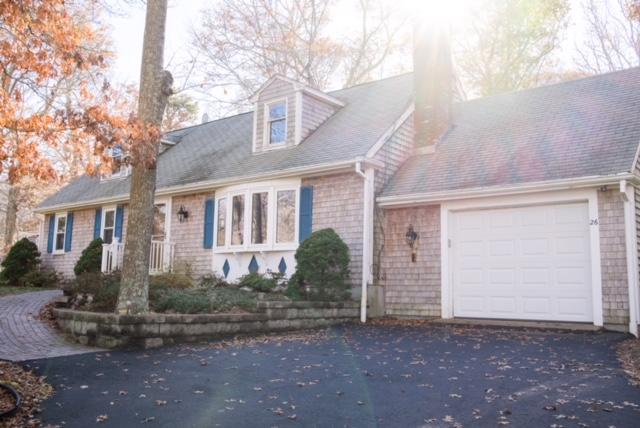26 Crowell Road Sandwich, MA 02563 - Photo 2 of 14 a front view of a house with garden