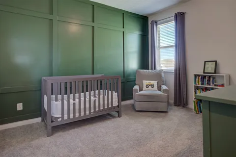 a bedroom with furniture and a window