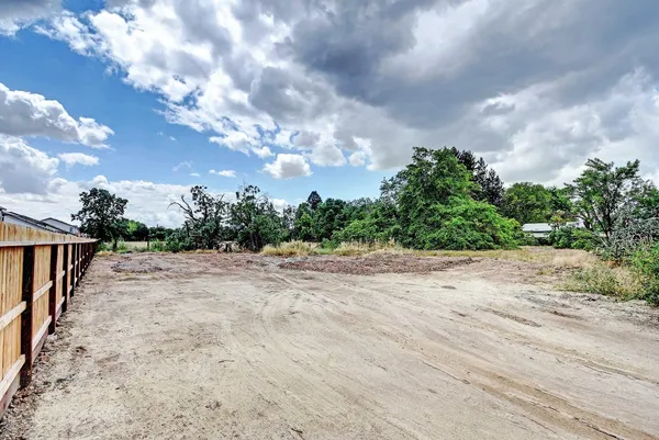 a view of a swimming pool with a garden