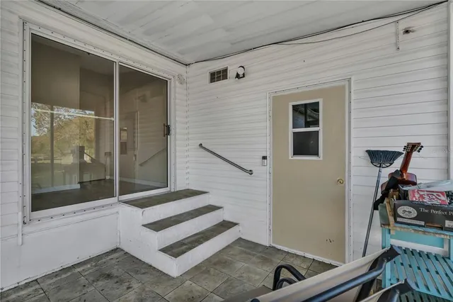a view of front door and bedroom