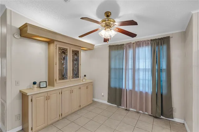 a view of a hallway with closet and bathroom