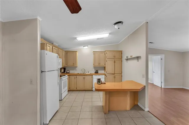 a kitchen with stainless steel appliances a refrigerator and a sink