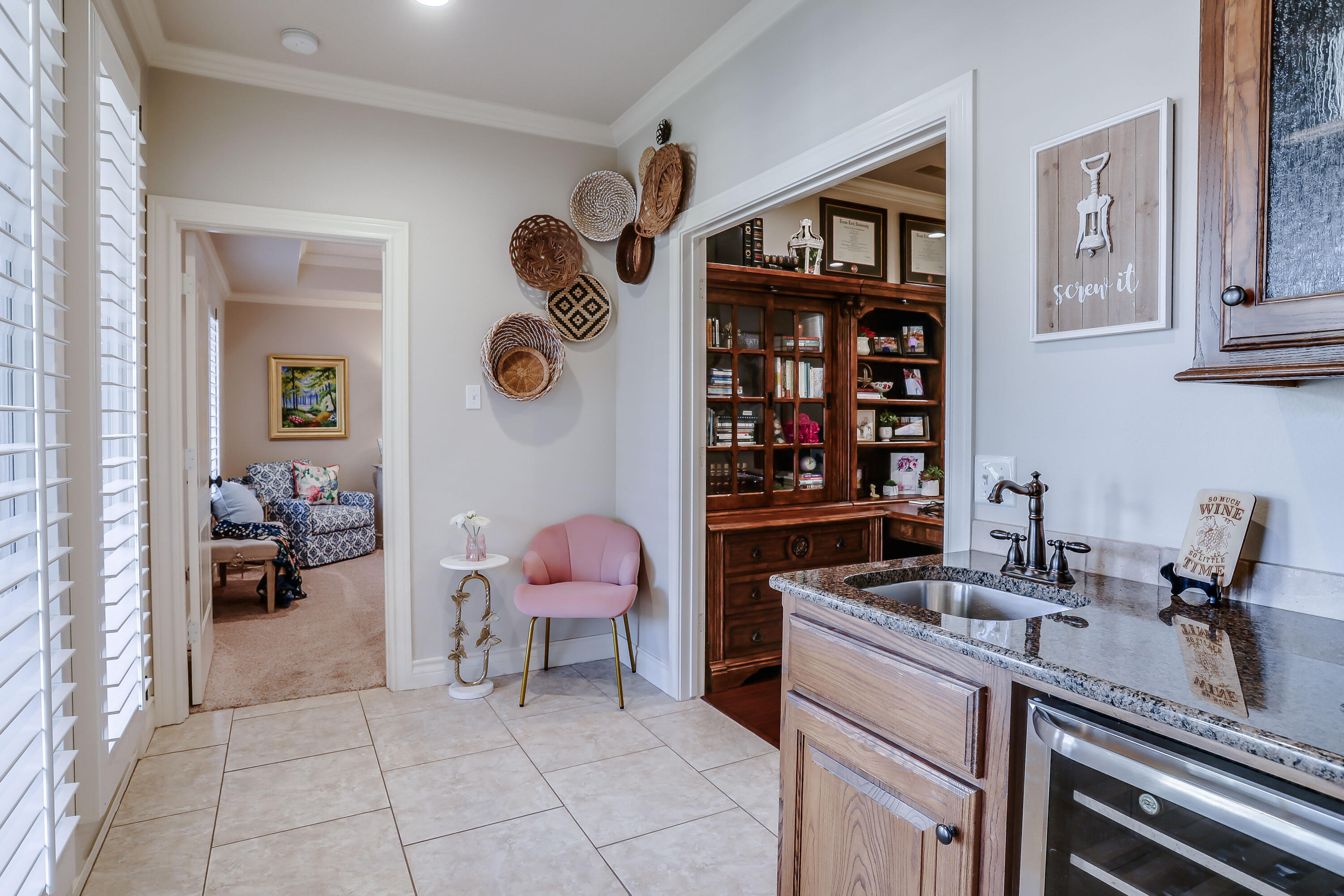 3804 103rd Street Lubbock, TX 79423 - Photo 11 of 32 a kitchen with a sink and a stove with wooden floor