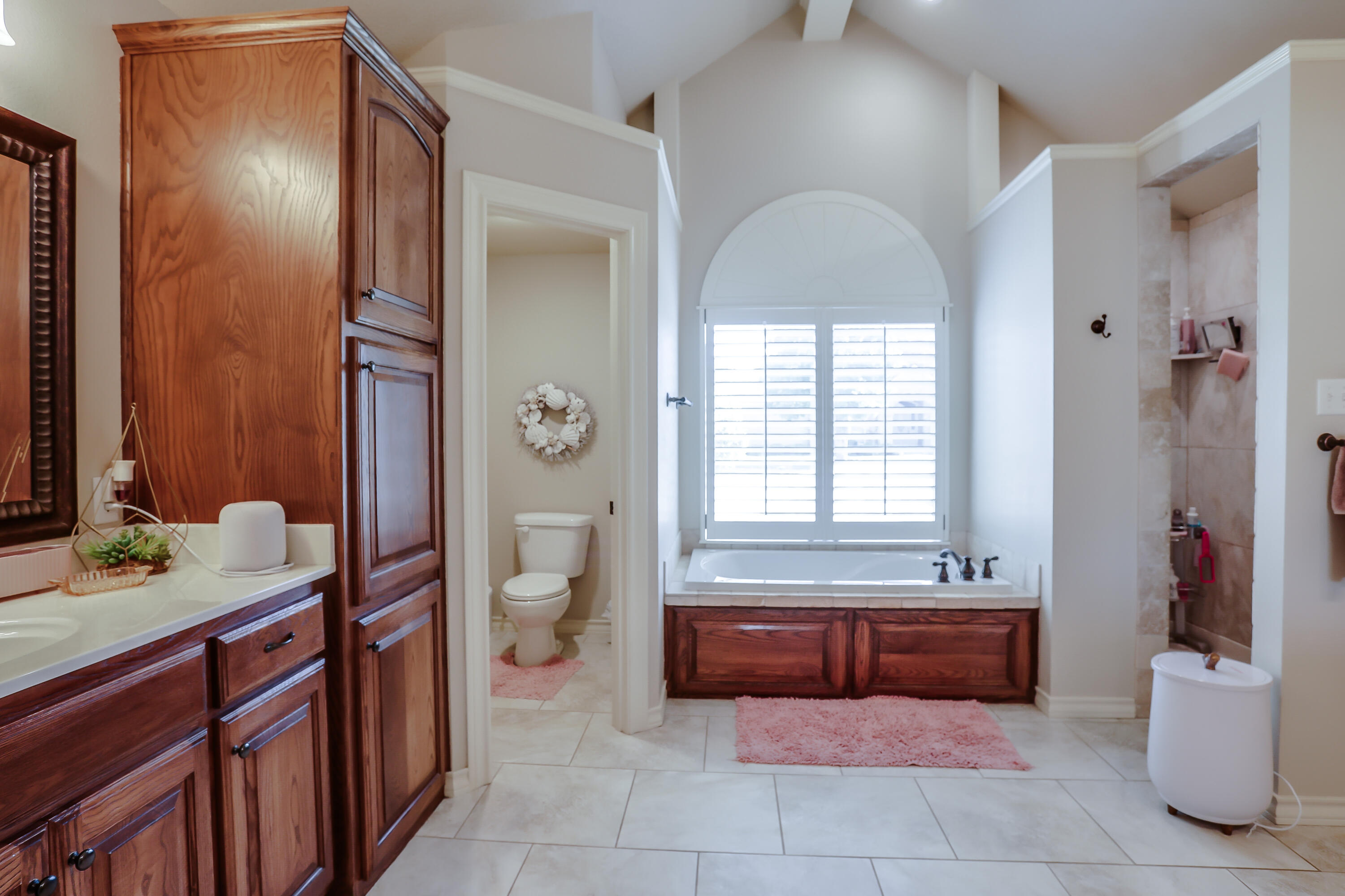 3804 103rd Street Lubbock, TX 79423 - Photo 12 of 32 a spacious bathroom with a bathtub sink and toilet