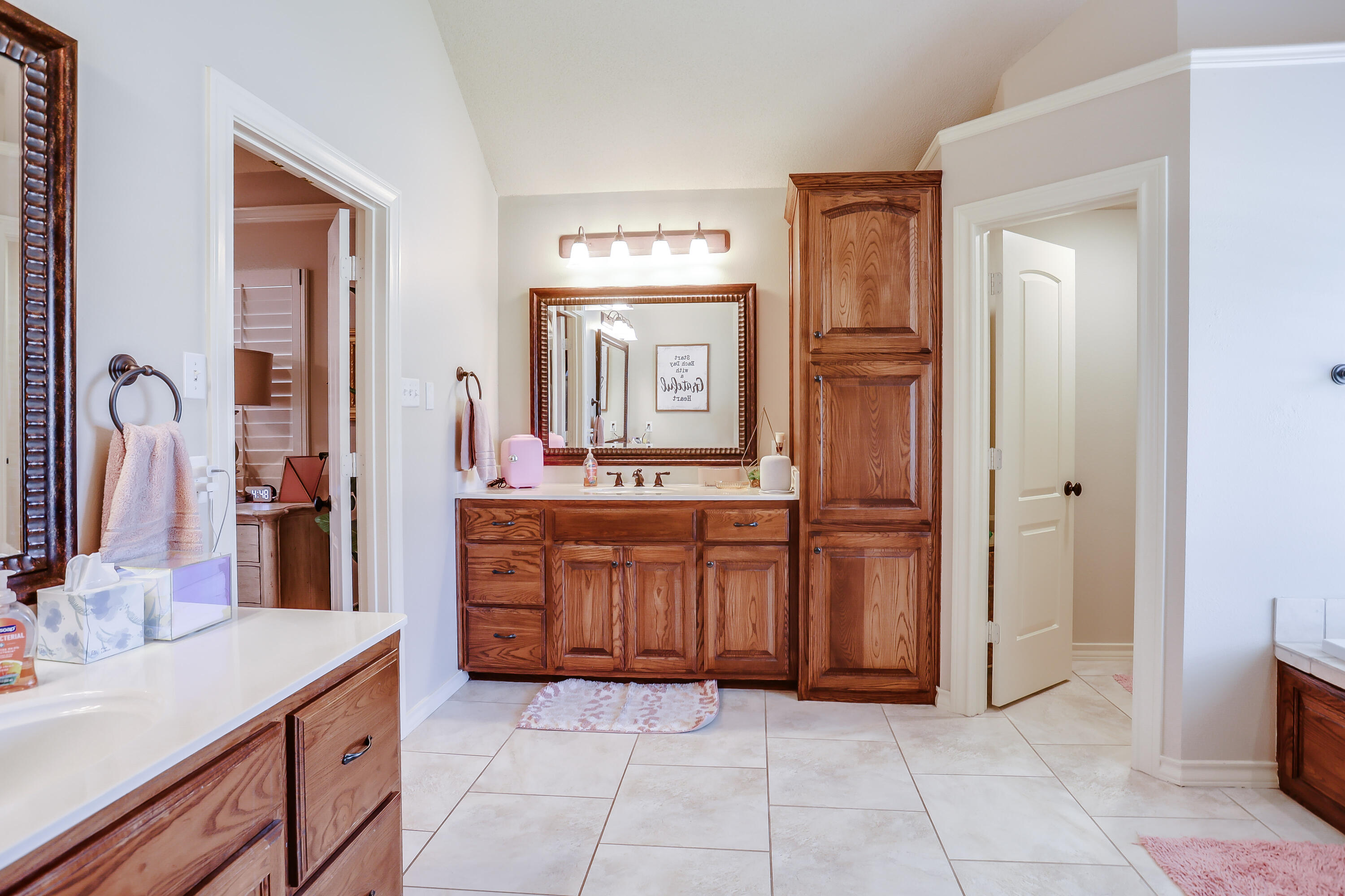3804 103rd Street Lubbock, TX 79423 - Photo 14 of 32 a bathroom with a granite countertop sink and a mirror