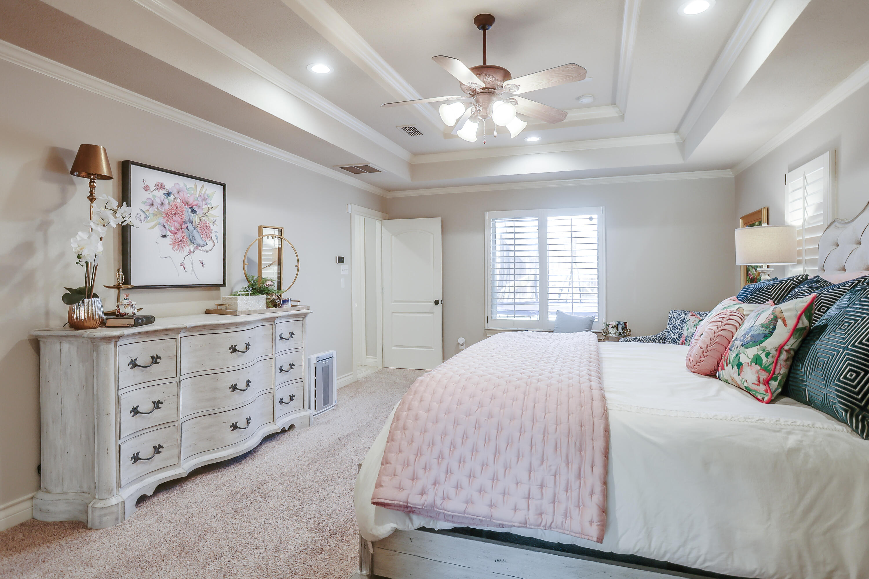 3804 103rd Street Lubbock, TX 79423 - Photo 15 of 32 a bedroom with a large bed and a window