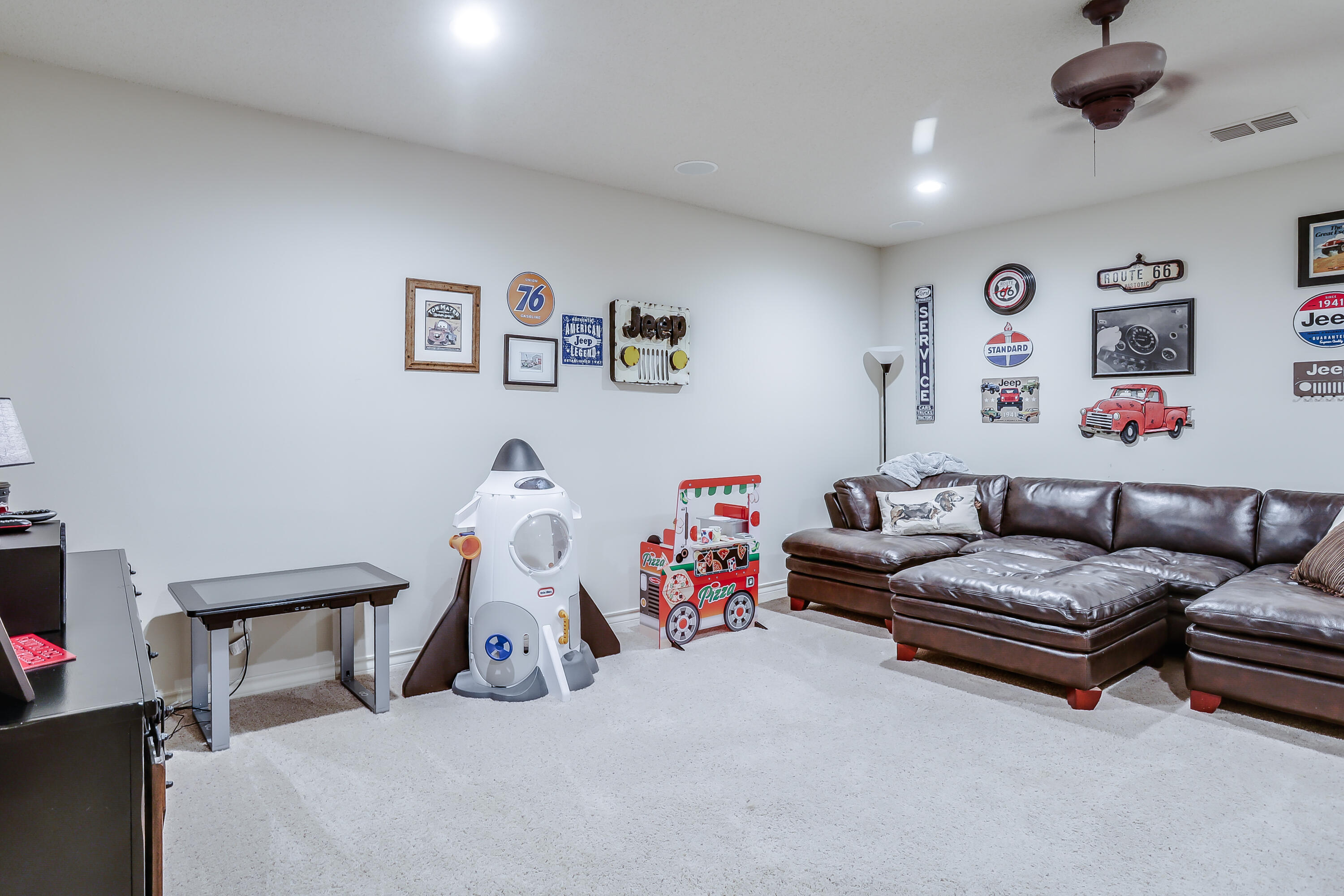 3804 103rd Street Lubbock, TX 79423 - Photo 29 of 32 a bedroom with furniture and a chandelier