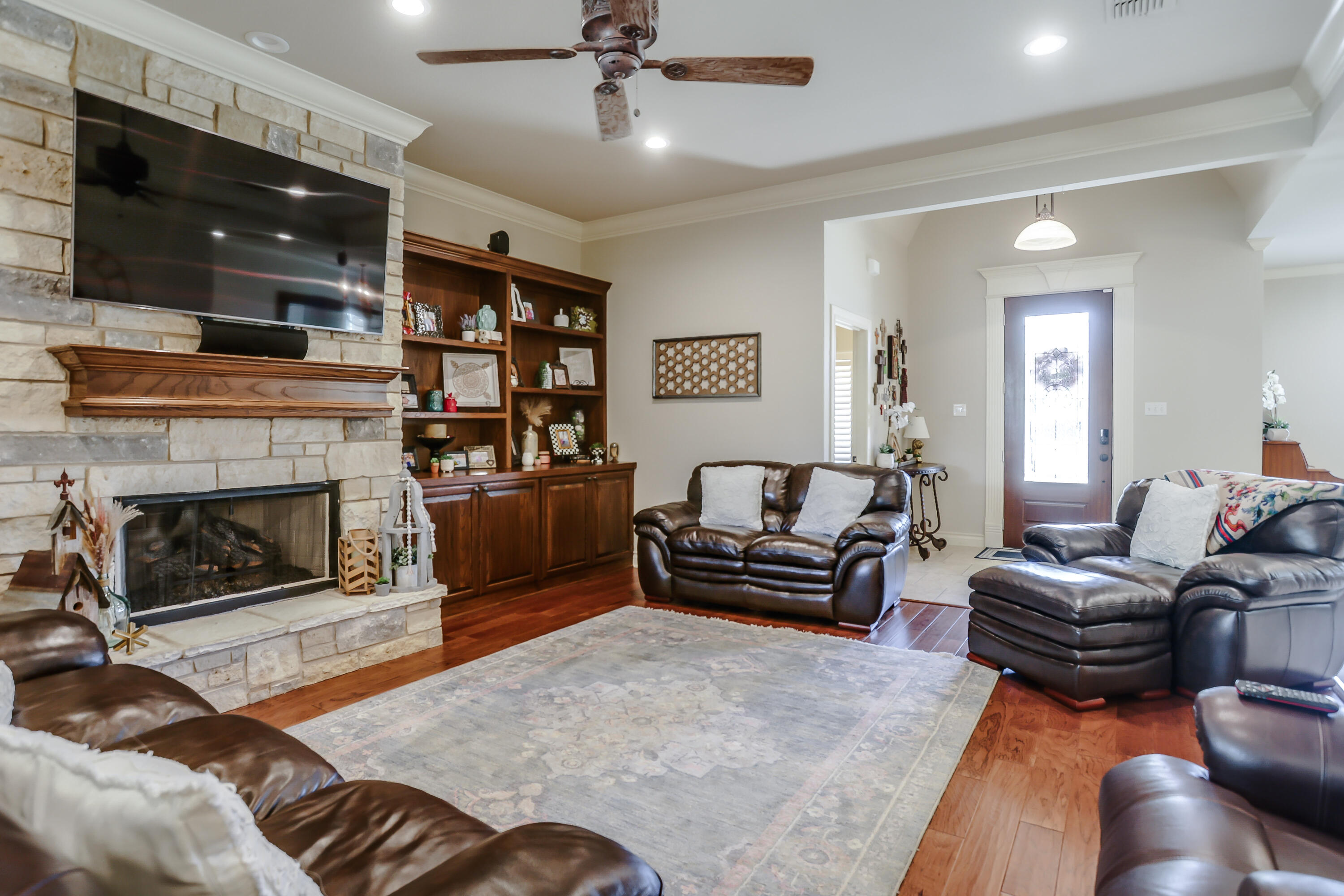 3804 103rd Street Lubbock, TX 79423 - Photo 3 of 32 a living room with furniture and a fireplace