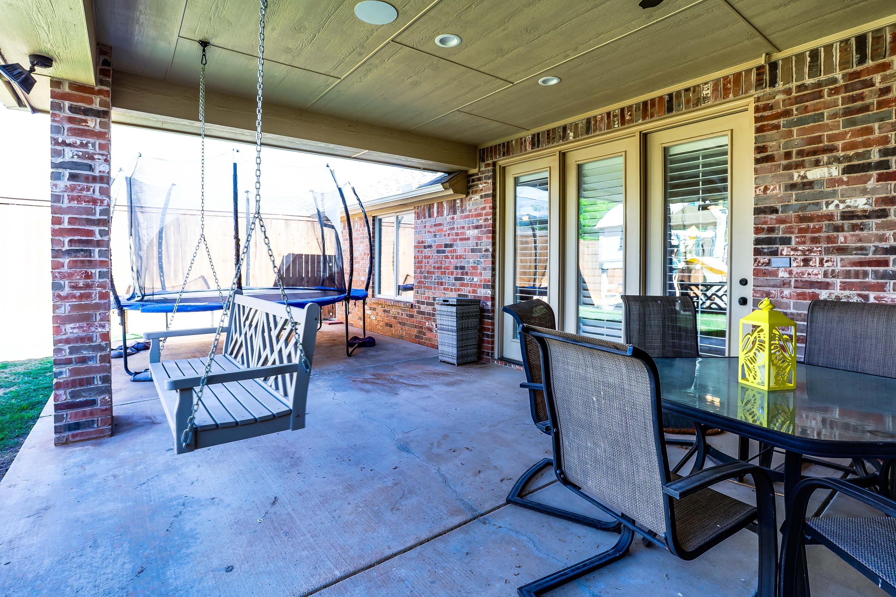 3804 103rd Street Lubbock, TX 79423 - Photo 31 of 32 a living room with furniture and floor to ceiling windows