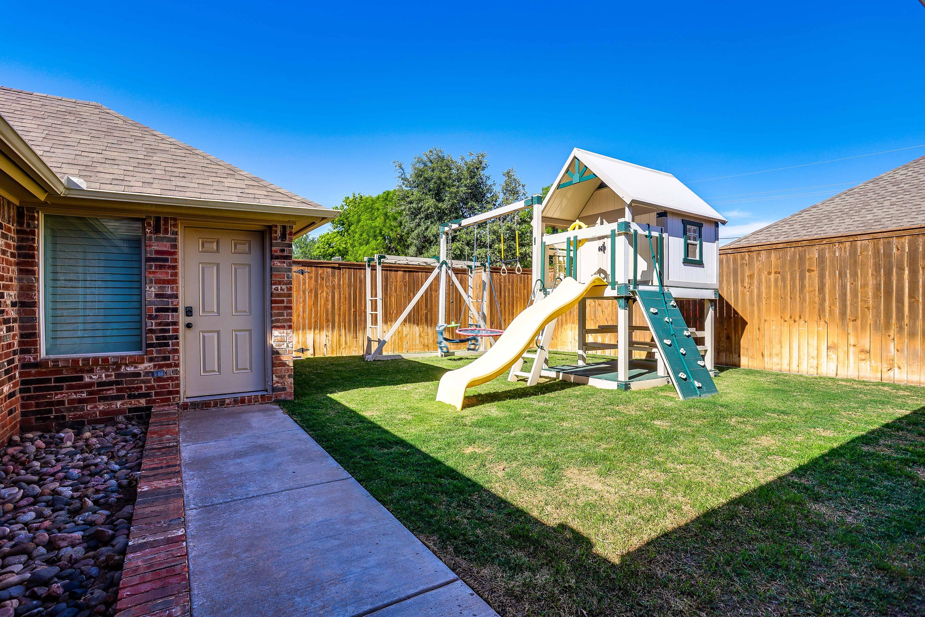3804 103rd Street Lubbock, TX 79423 - Photo 32 of 32 a view of a house with a yard