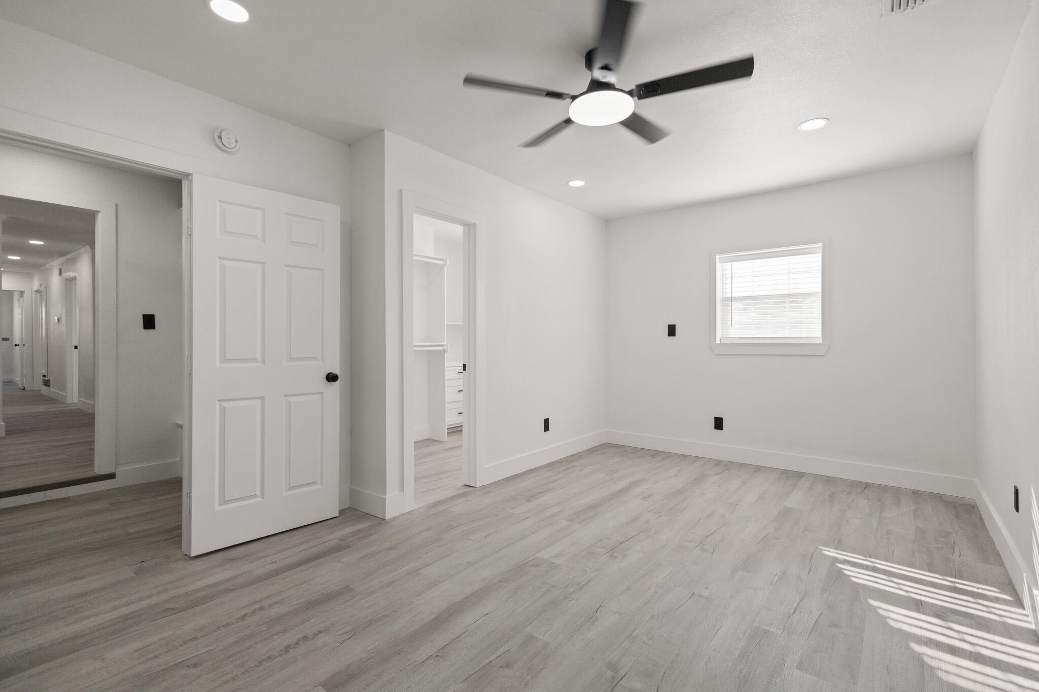 5512 45th Street Lubbock, TX 79414 - Photo 14 of 30 wooden floor in an empty room with a window