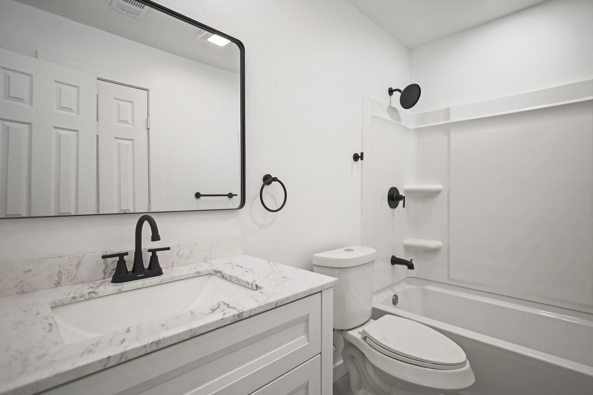 5512 45th Street Lubbock, TX 79414 - Photo 24 of 30 a bathroom with a sink a toilet and a shower