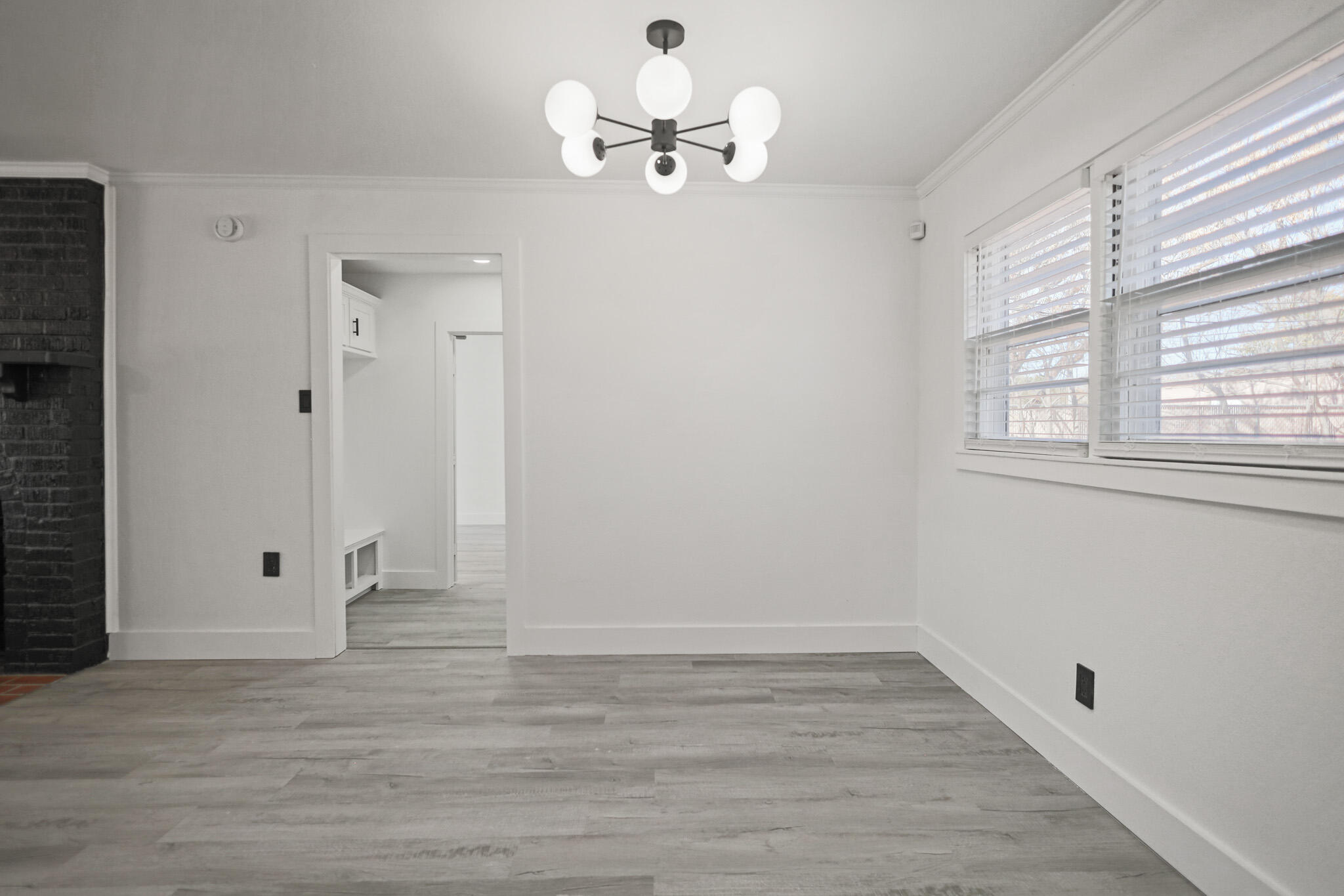 5512 45th Street Lubbock, TX 79414 - Photo 6 of 30 wooden floor in an empty room with a window