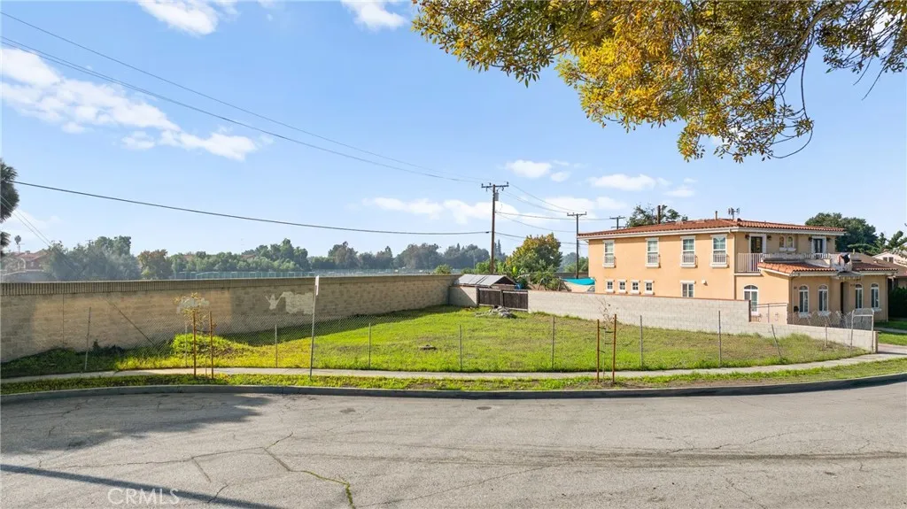 0 Nevada South Gate, CA 90280 - Photo 1 of 10 a view of a lake with a house in the background