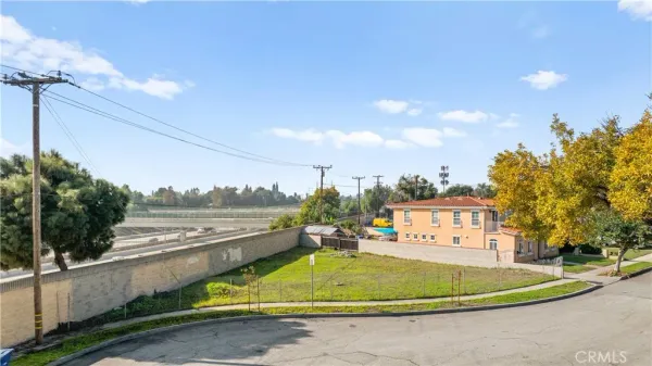 a view of a swimming pool with a yard and outdoor seating