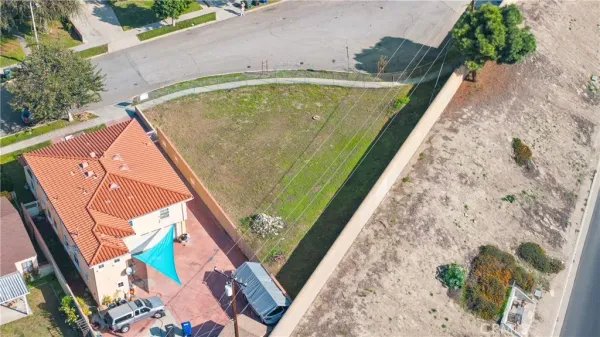 an aerial view of a house with a swimming pool